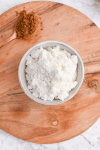 Dry protein powder in a small bowl