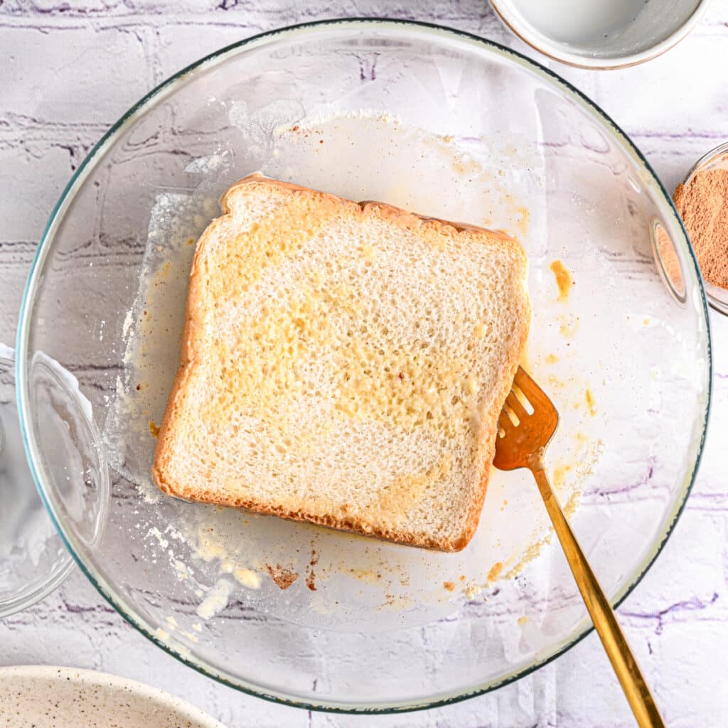 Flip French toast and soak