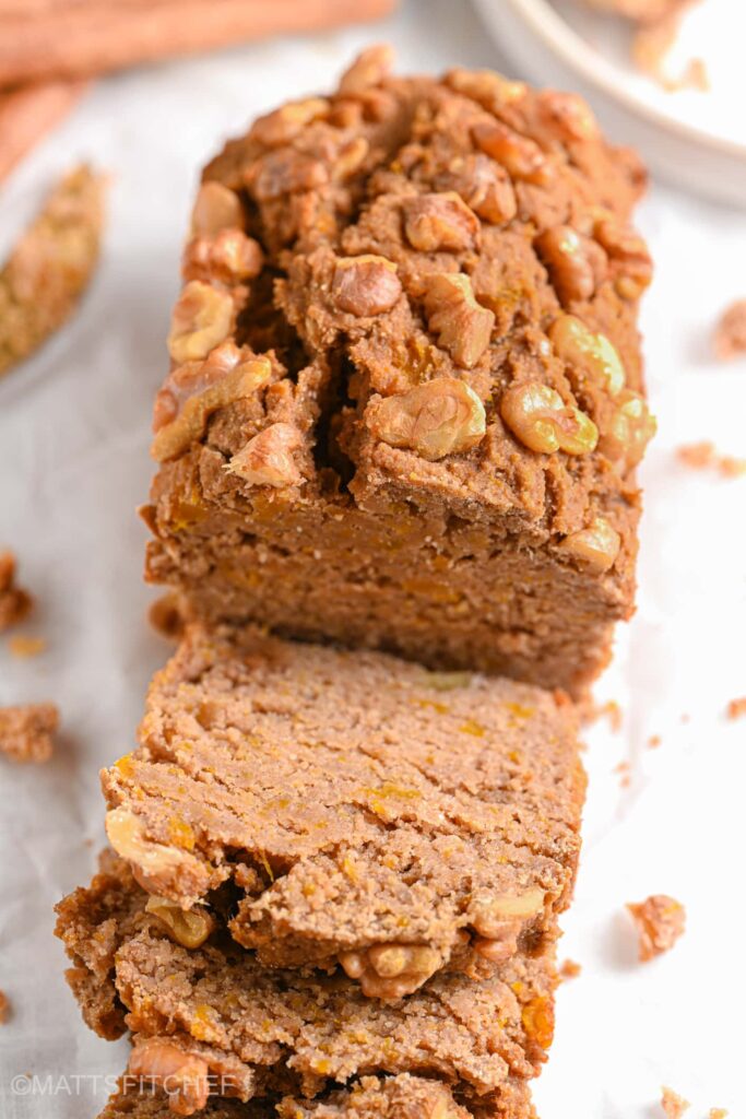 Moist slices of sugar-free banana bread with crunchy walnuts on top