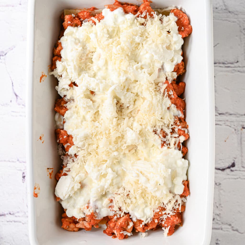 Top with cottage cheese, mozzarella and Parmesan