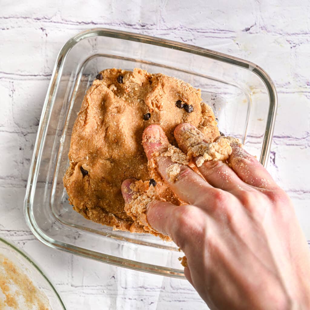 Pressing dough into the pan