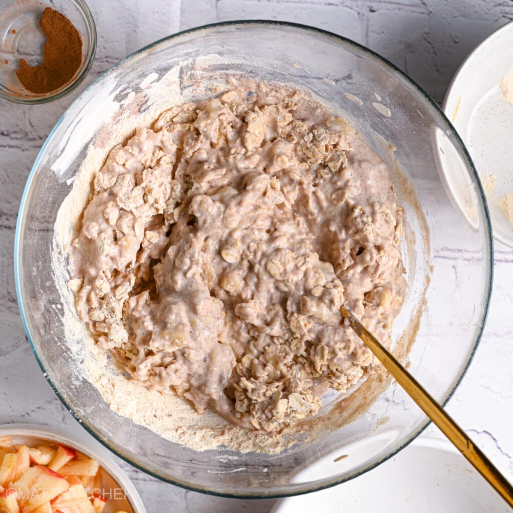 Stirring dough after adding oats and oat flour