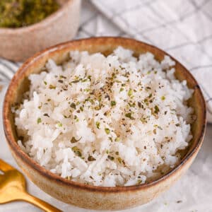 Fluffy microwave rice in a ceramic bowl, ready to serve.