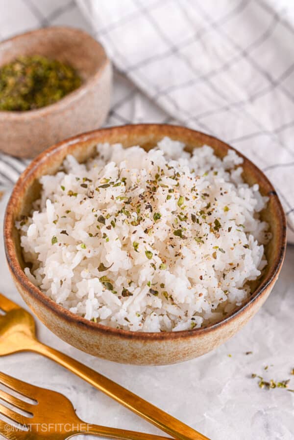 Fluffy microwave rice in a ceramic bowl, ready to serve.