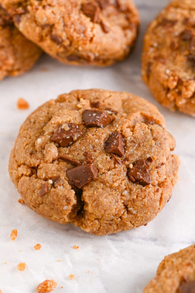 Freshly baked gluten-free protein powder cookies cooling on a baking sheet