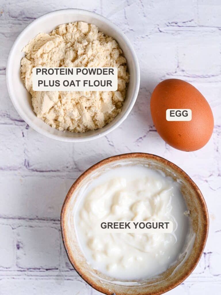 Ingredients for making pancakes with protein powder - protein powder, oat flour, Greek yogurt and egg.