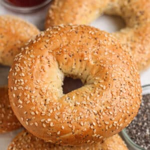 Golden-brown cottage cheese bagels topped with sesame seeds and poppy seeds.