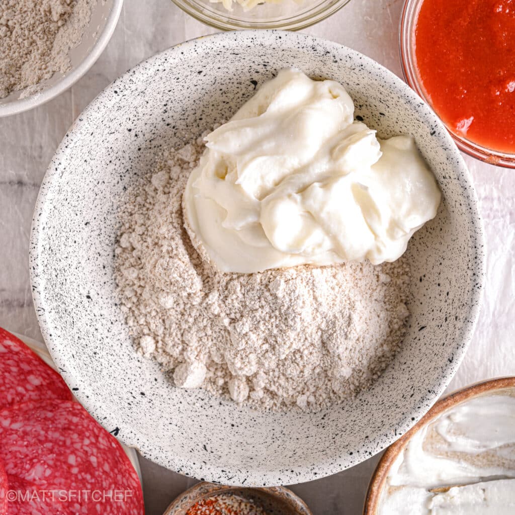 Cottage cheese added to flour – Creamy cottage cheese blended with whole wheat flour for a protein-packed pizza dough.