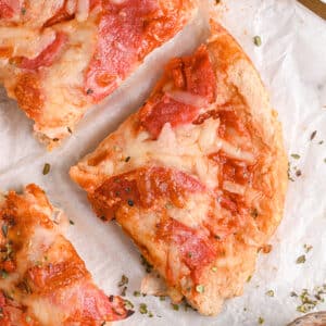 Close-up of pizza slice – A detailed view of a protein-packed pizza slice with golden crust, melted cheese, and savory turkey salami.