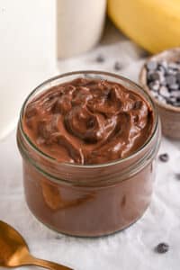Cottage Cheese Pudding served in a cup, in its dark chocolate protein version.
