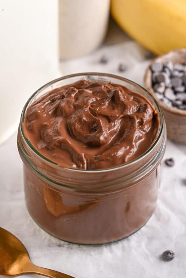 Cottage Cheese Pudding served in a cup, in its dark chocolate protein version.