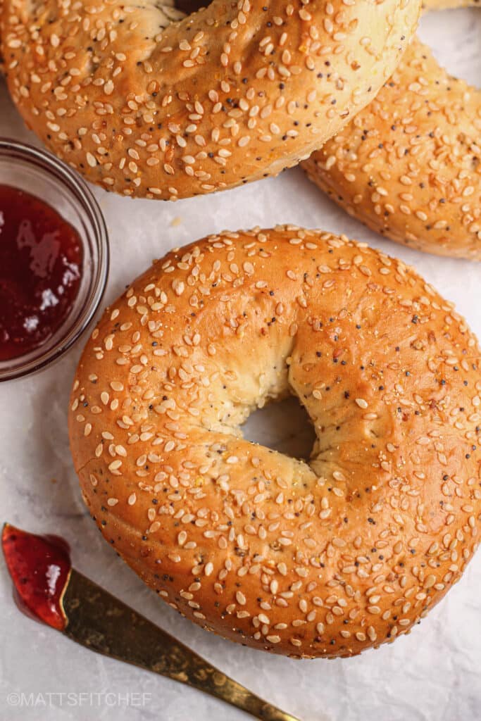 Protein cottage cheese bagels served with jam, perfect for breakfast or snacks.