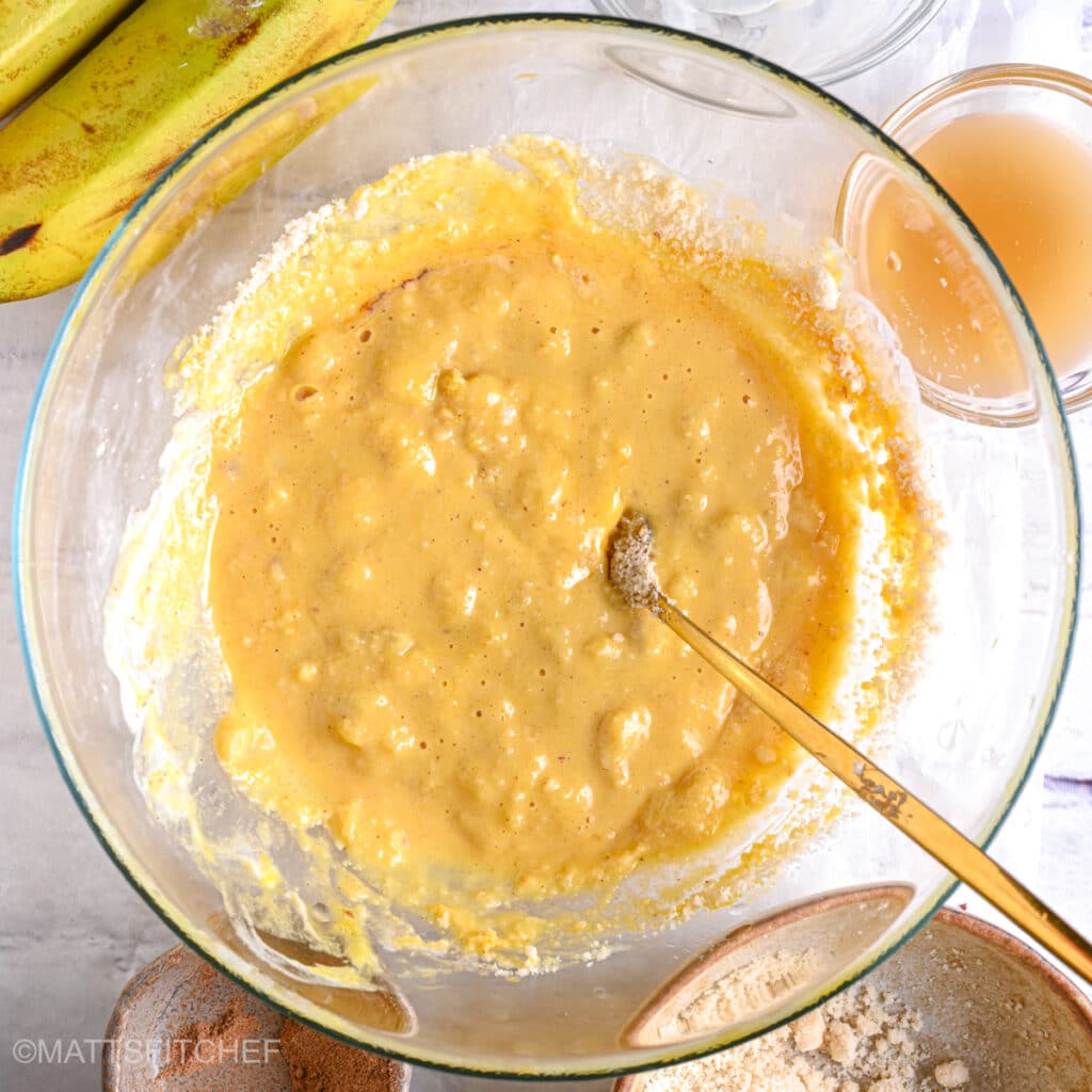 Banana bread batter after combining dry and wet ingredients in a smooth batter.