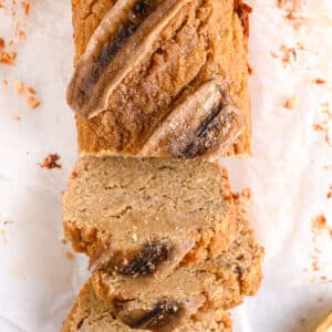 Healthy almond flour banana bread shown from top, sliced into soft, moist slices ready to be served with toppings.