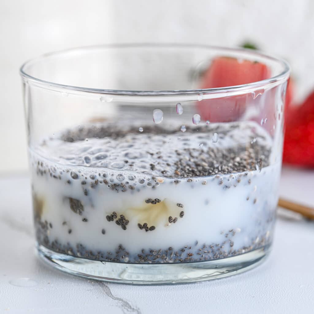 Chia seeds with milk and optional maple syrup, before stirring and refrigerating