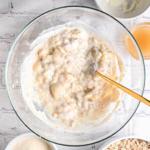 Mashed ripe bananas mixed with Greek yogurt and vanilla extract, before adding oats and strawberries.