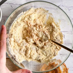 Mixing protein dough with a golden fork until smooth and workable.