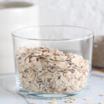 Old fashioned rolled oats in a glass to make overnight oats