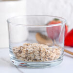 Old fashioned rolled oats in a glass