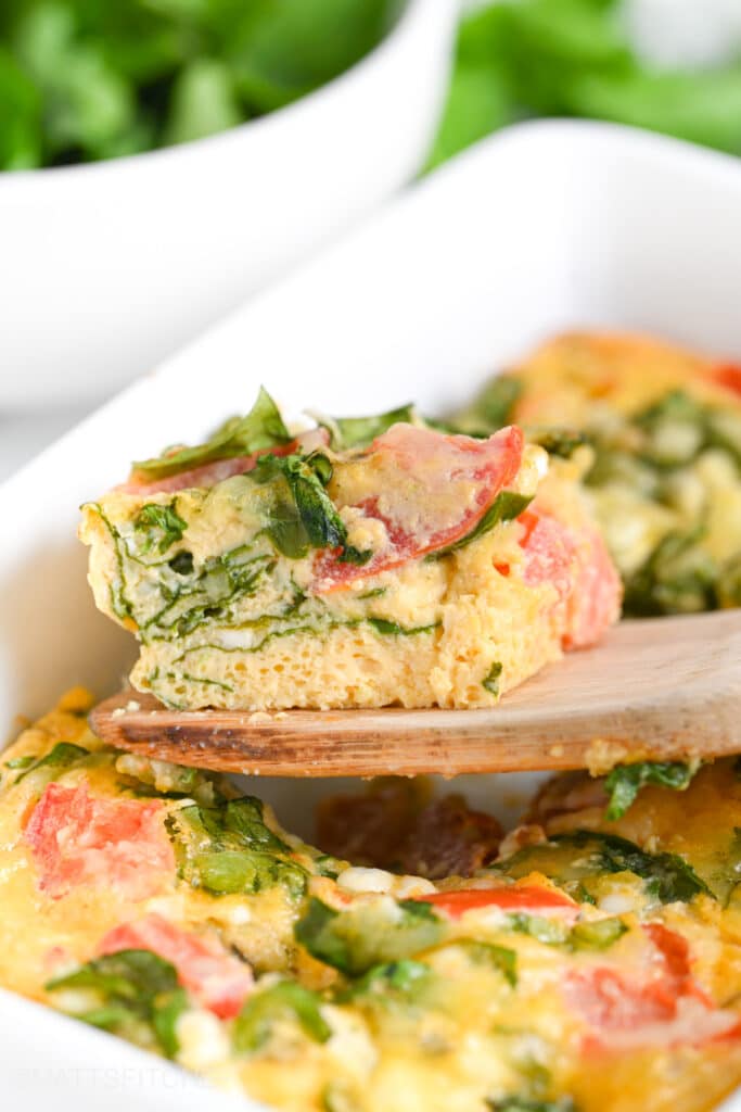 Front view of baked cottage cheese eggs with spinach.