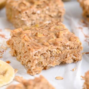 Banana oat bars sliced into squares, highlighting their soft and chewy texture from old fashioned rolled oats