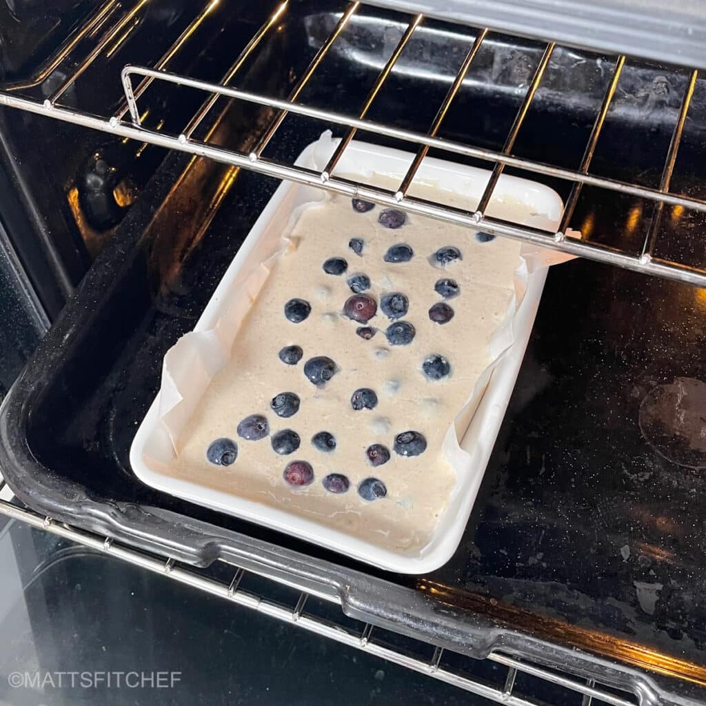 Blueberry cottage cheese breakfast bake in oven, ready for baking