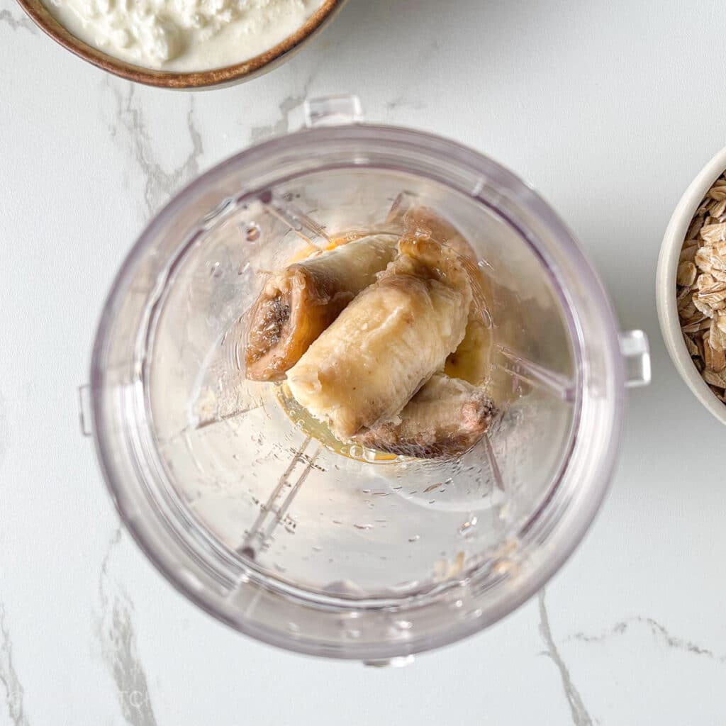 Ripe bananas added to blender with egg for natural sweetness