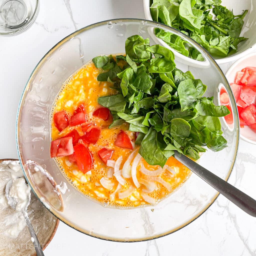 Chopped and diced vegetables added to cottage cheese egg mixture.