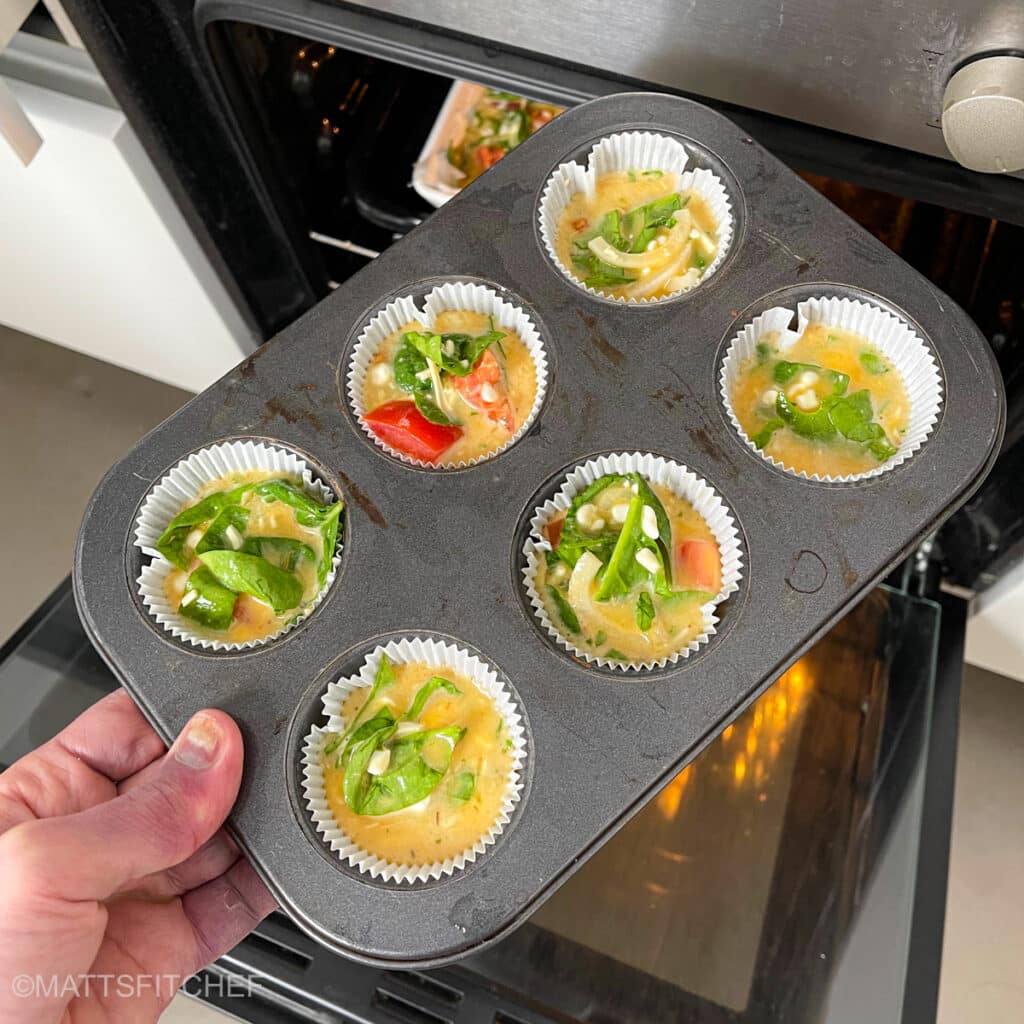 Placing muffin mold with high protein egg mixture in the oven