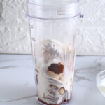 Adding protein powder to Greek yogurt and frozen bananas before blending into a creamy protein gelato