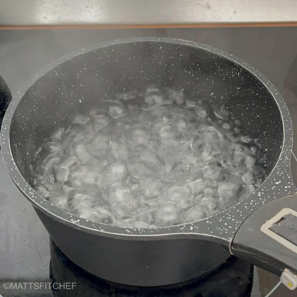 Boiling water in a large pot, ready to add chickpea pasta.