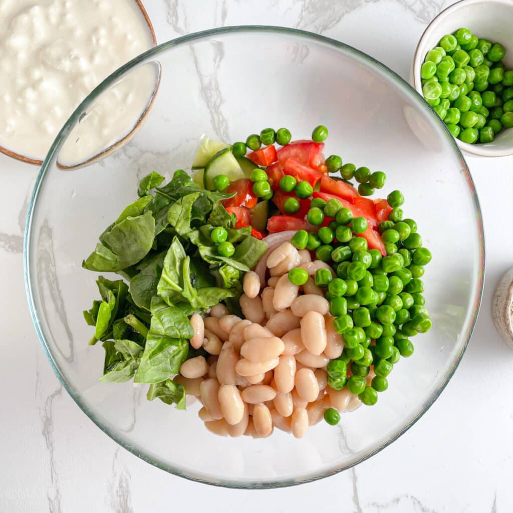 White beans and peas added to the chopped vegetables, for extra protein, nutrients and texture