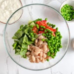 White beans and peas added to the chopped vegetables, for extra protein, nutrients and texture