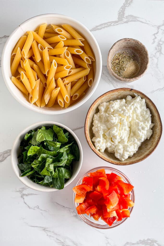 Ingredients for low calorie pasta salad – chickpea penne or regular pasta, cottage cheese for protein, vegetables, seasonings and dressing without mayo