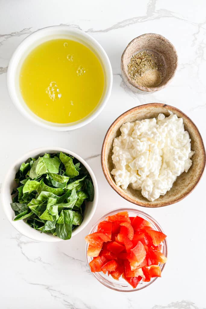 Ingredients in Starbucks egg white bites – liquid egg whites, whole milk cottage cheese, chopped fresh spinach, roasted bell pepper, seasonings and optional mozzarella cheese