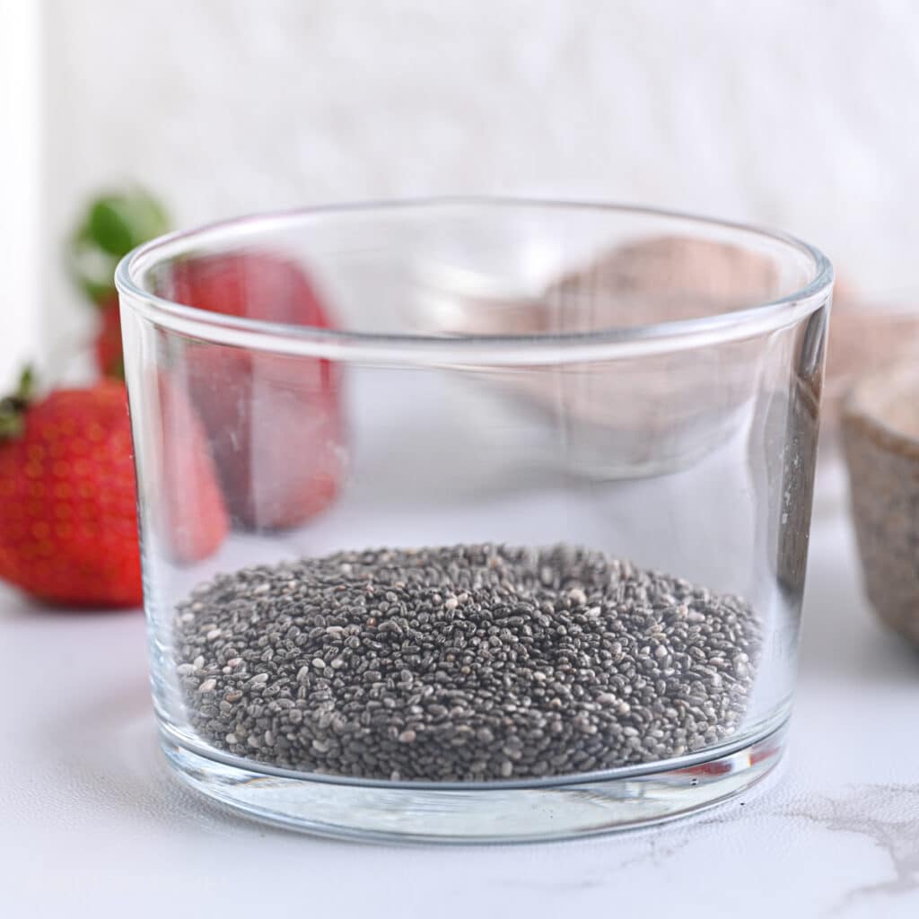 Chia seeds in a glass, ready to combine with other ingredients