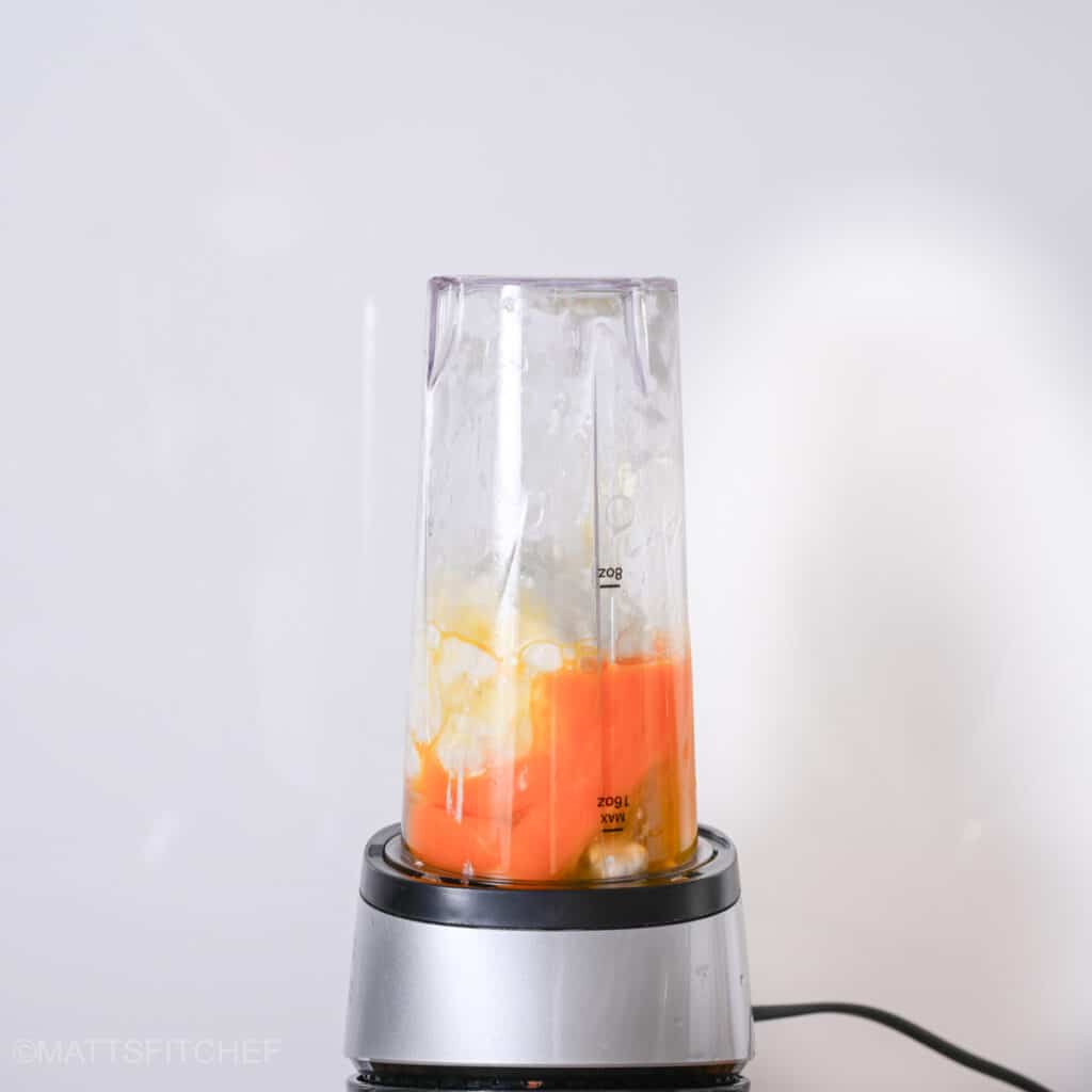 Bullet blender with 4% fat cottage cheese and eggs, ready for blending