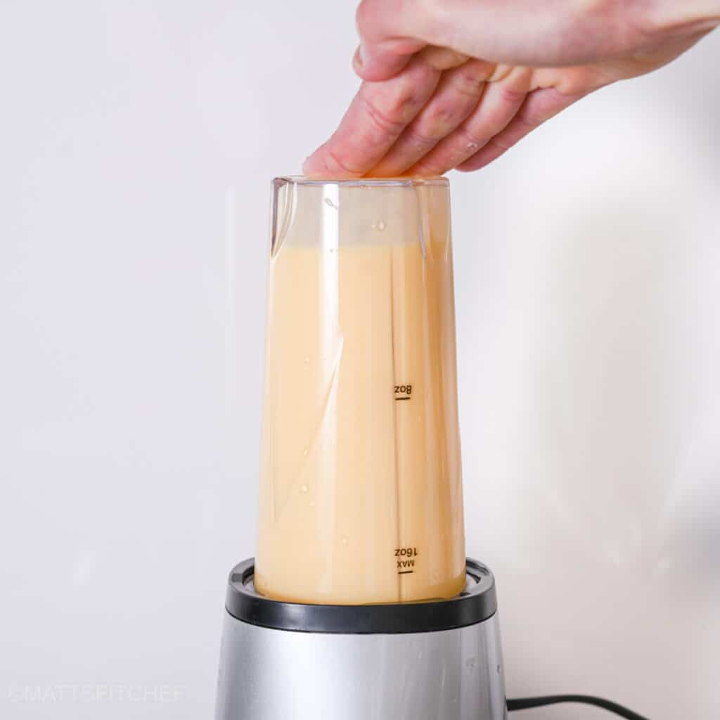 Blending cottage cheese with eggs until smooth