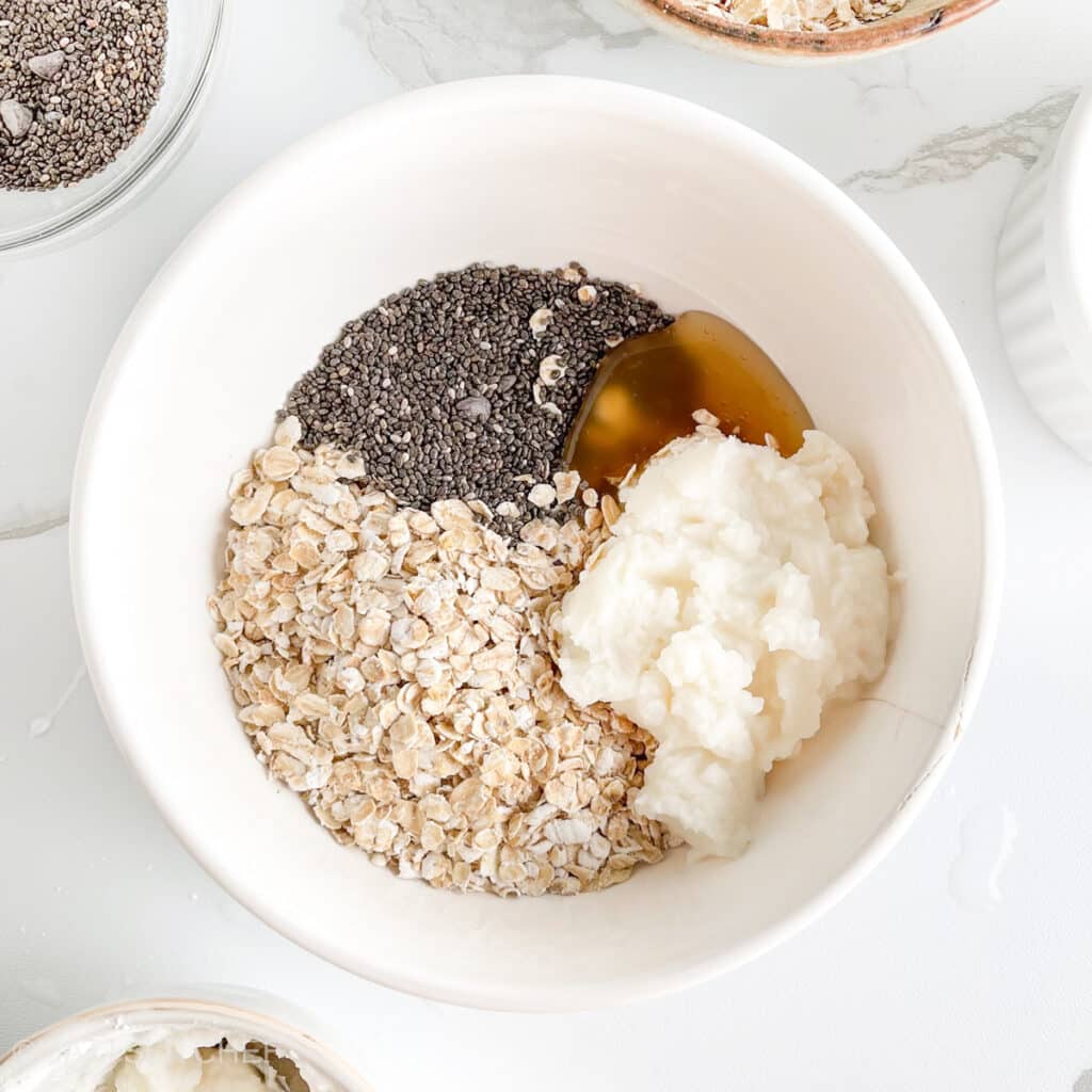Ingredients for cottage cheese overnight oats in a bowl, before adding milk and mixing