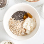 Ingredients for cottage cheese overnight oats in a bowl, before adding milk and mixing
