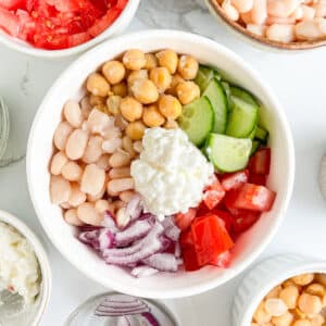 Mixed beans and vegetables in a bowl, ready to mix into a high protein salad