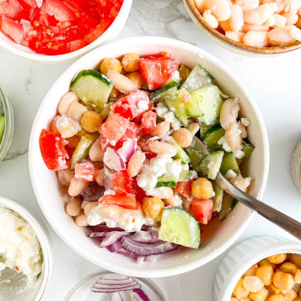 Beans and vegetables after mixing, ready to add Mediterranean salad dressing