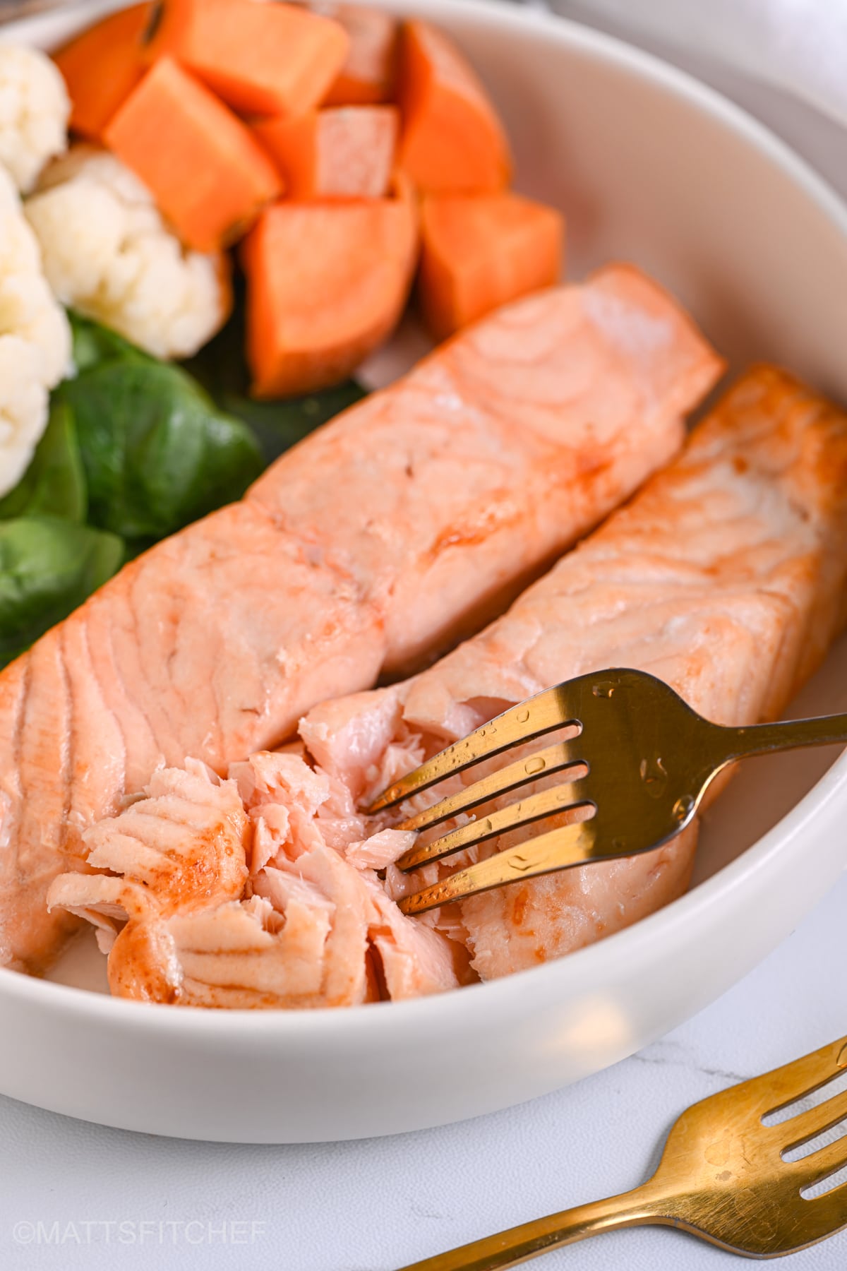 Flaky air fryer frozen salmon fillets with juicy inside and crispy outside