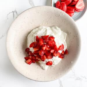 Diced strawberries added to honey Greek yogurt