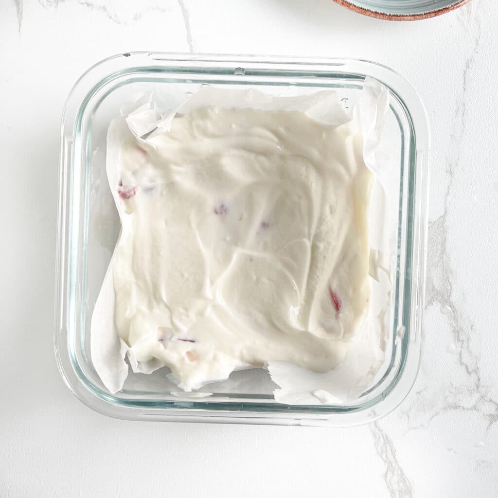 Mixture for Greek yogurt bars in a parchment paper lined pan