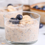 Meal prep overnight oats with protein powder, served with juicy blueberries and sliced banana