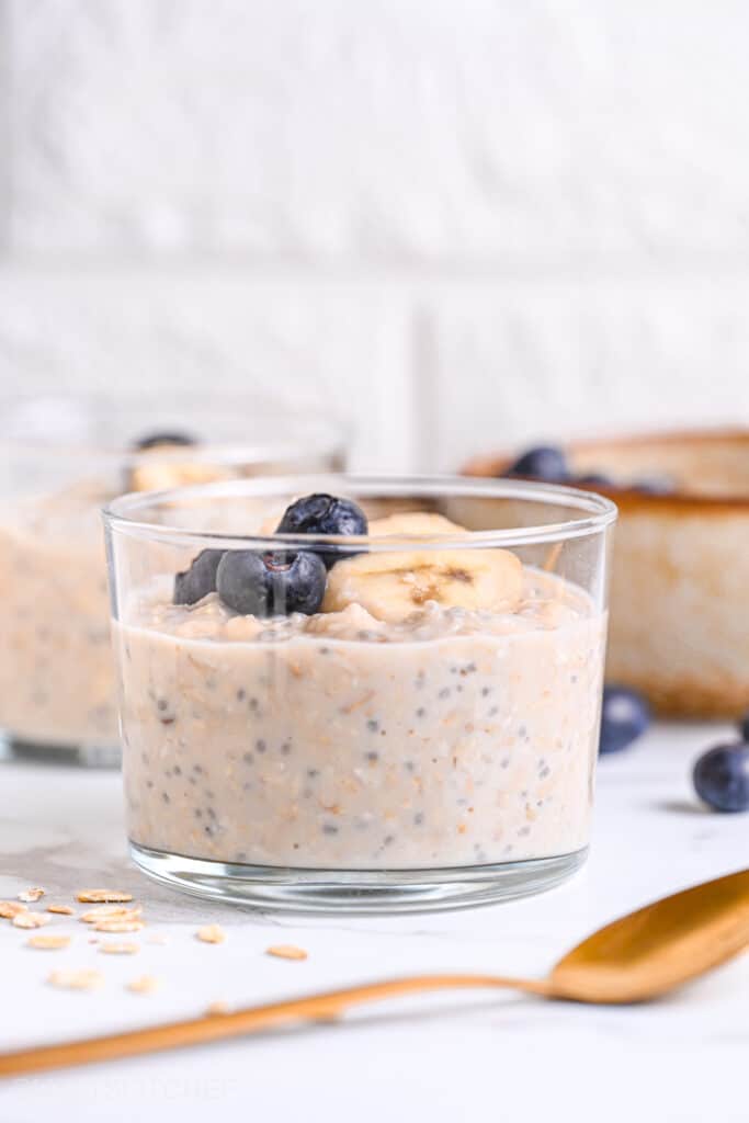 Front view of protein powder overnight oats, with blueberries and banana as topping