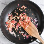 Sautéing onion and garlic in a skillet before blending with cottage cheese