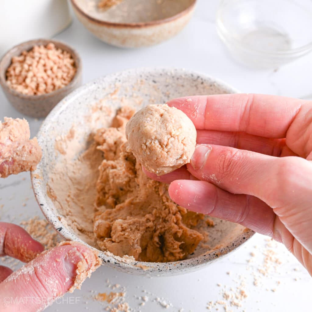Shaping protein balls from PB2 dough using the hands