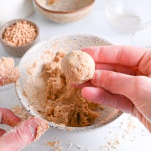 Shaping protein balls from PB2 dough using the hands